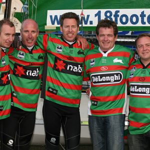 De'Longhi-Rabbitohs crew with sponsors wearing the famous South Sydney Rabbitohs Rugby League jersey