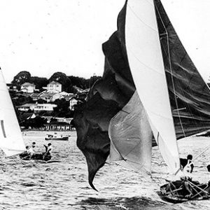 18 foot skiff The Fox chases series winner Schemer at the 1963 Giltinan world Championship in Auckland