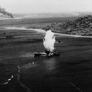 A Mark XIII aerial torpedo hits a Japanese cargo ship, during the first day of U.S. Navy carrier air raids on Truk, 17 February 1944. Note the several torpedo wakes, including one very erratic one ending with the torpedo broaching. Photographed by War Correspondent Smith. Official U.S. Navy Photograph, now in the collections of the National Archives.