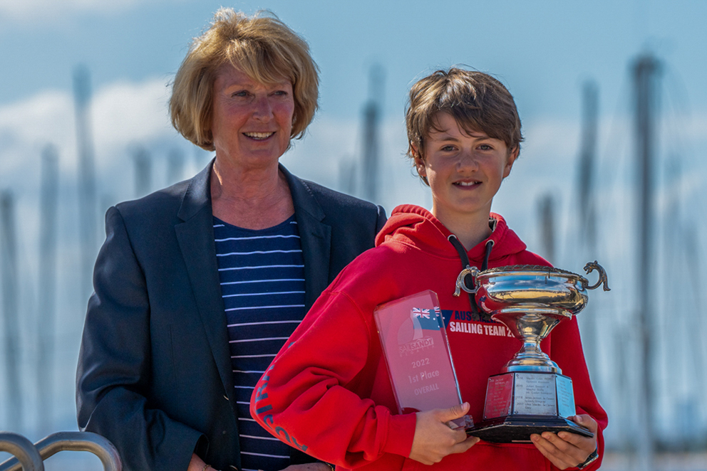 Callum Simmons being presented with the award for champion boat of the regatta by Sandringham Yacht Club Commodore Sue Bowes