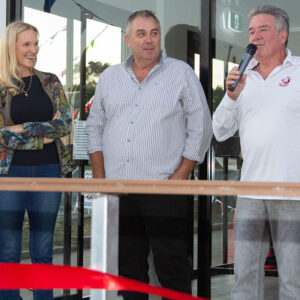 Mooloolaba Yacht Club members and single-handed sailing record holders Margaret Williams, Bruce Arms with MC Robert Stevenson at the opening of the new clubhouse. Photo Mark Dowsett