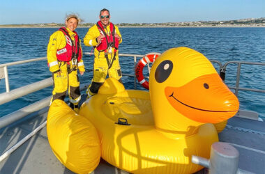 Paddleboarder rescues three men on giant inflatable duck