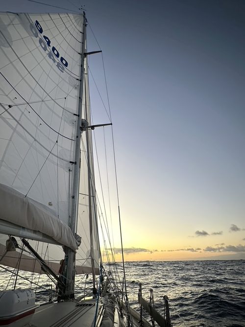 Sunset over the Tasman Sea seen from the deck of Polaris 2 under sail